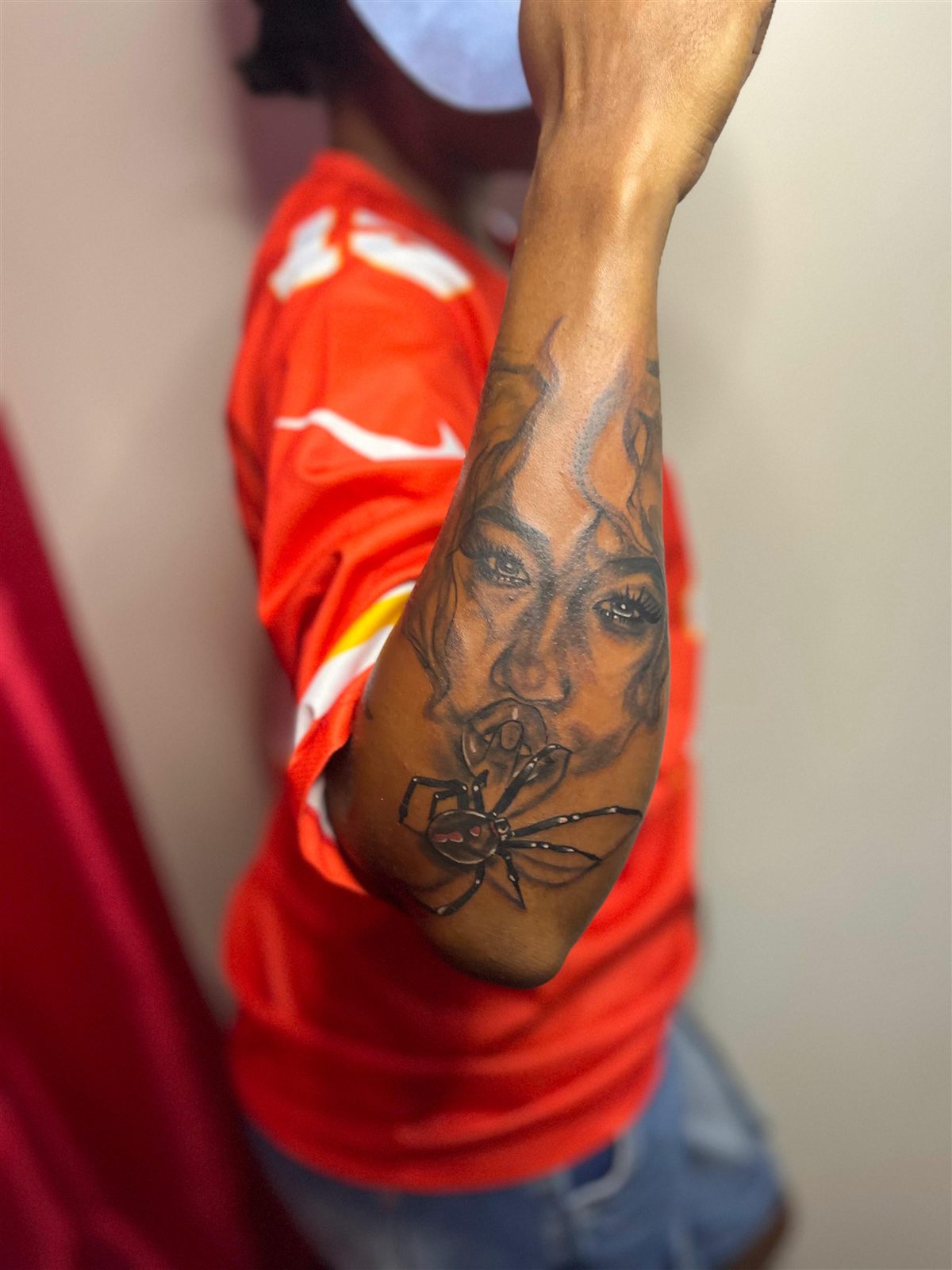 Portrait with a spider, black and grey, forearm